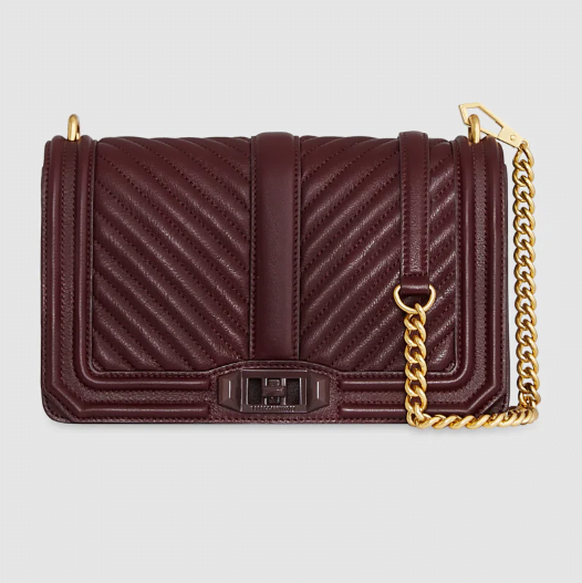 A burgundy quilted crossbody bag with gold hardware and a gold chain strap, designer look for less