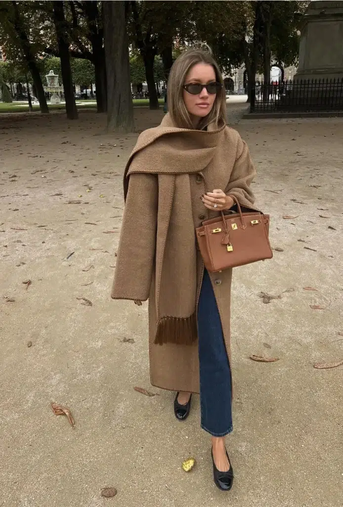 French woman wearing a cashmere coat in brown