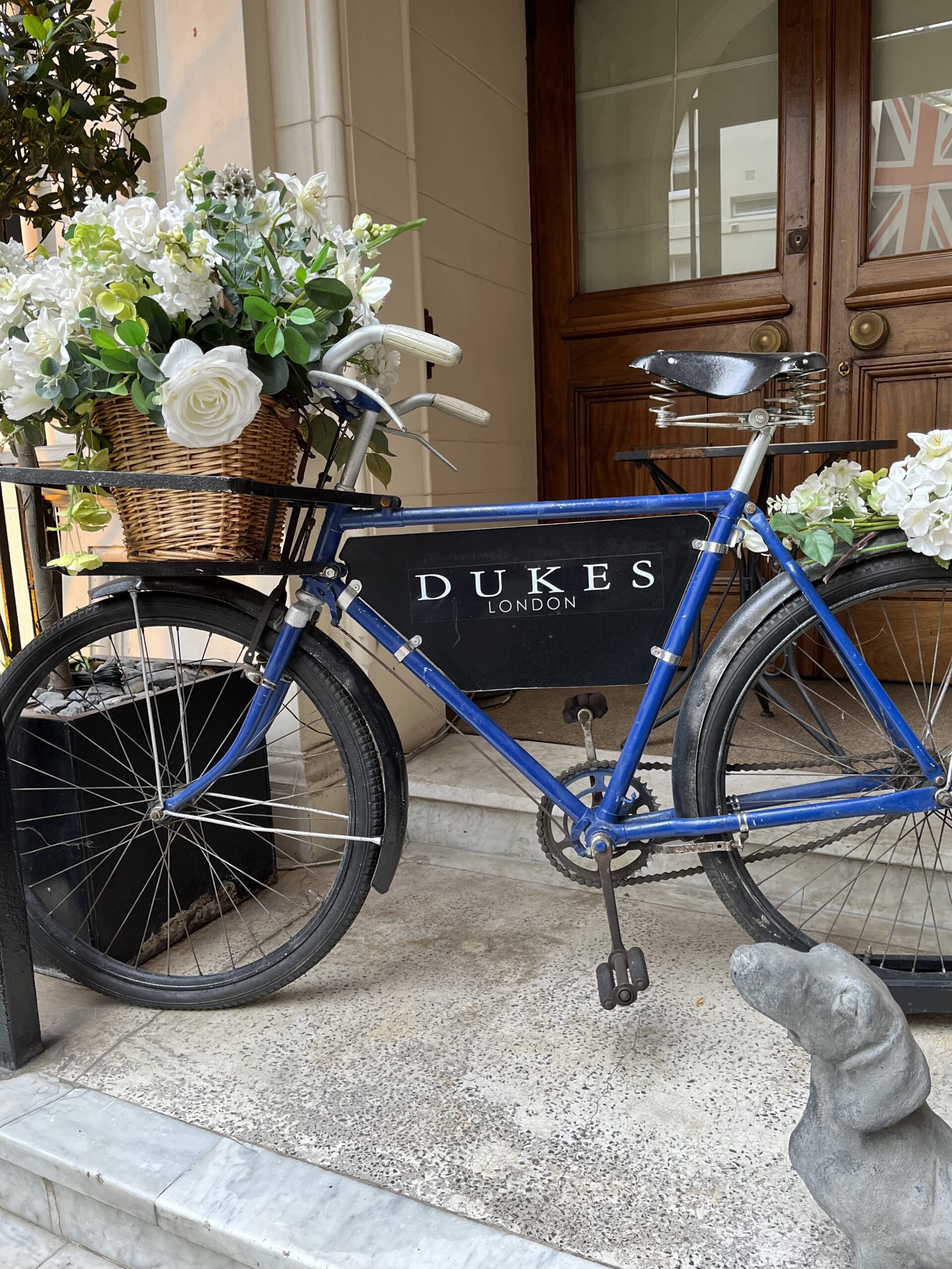 Dukes Bar London Mayfair Hotel | Fifth and Paris Dukes Bar London Mayfair Hotel, bicycle with potted flowers in front of Dukes bar sign